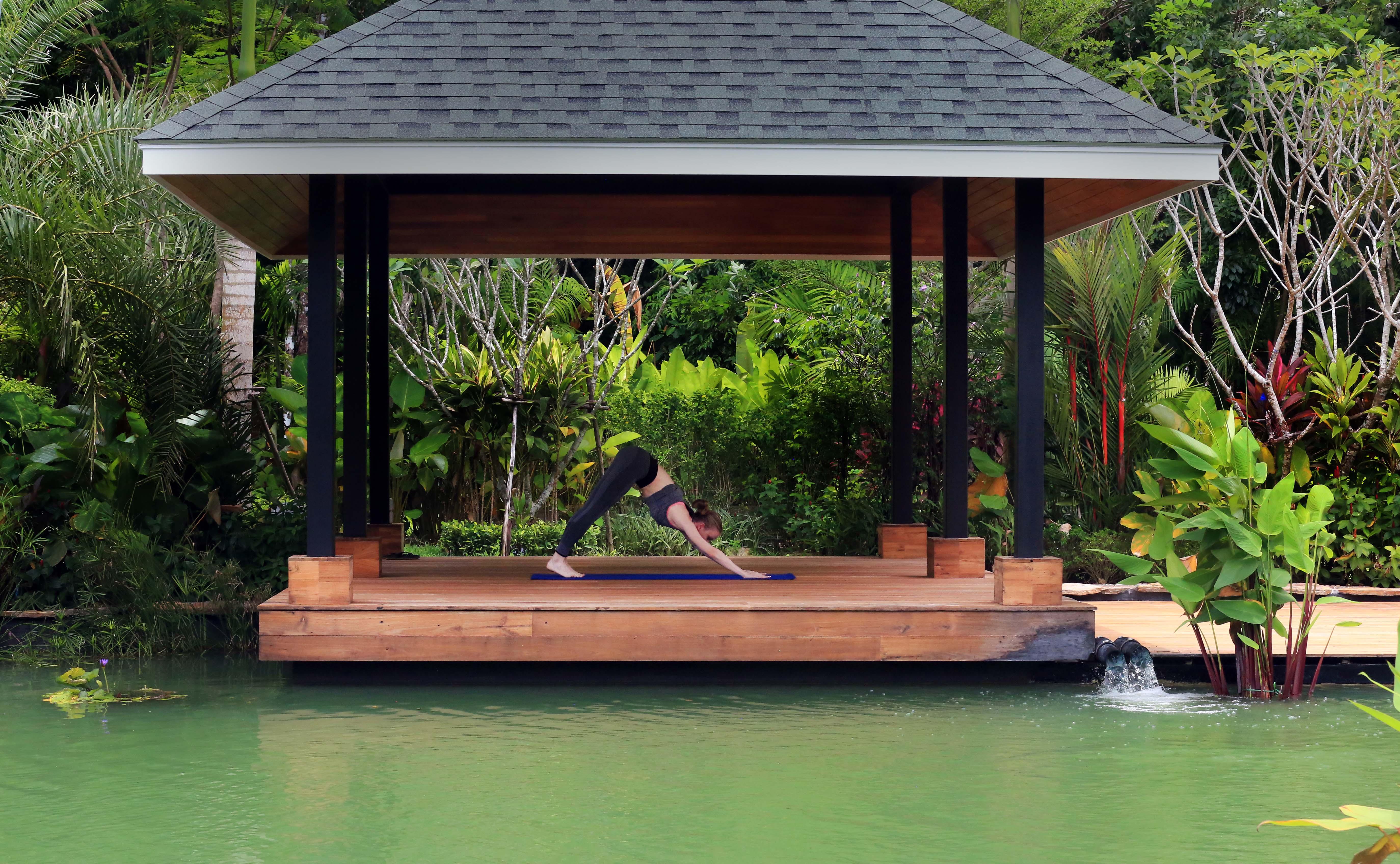 The Pavilions Phuket (Adults Only) Bang Tao Beach  Exterior photo A woman practicing yoga at the BANYAN TREE Spa